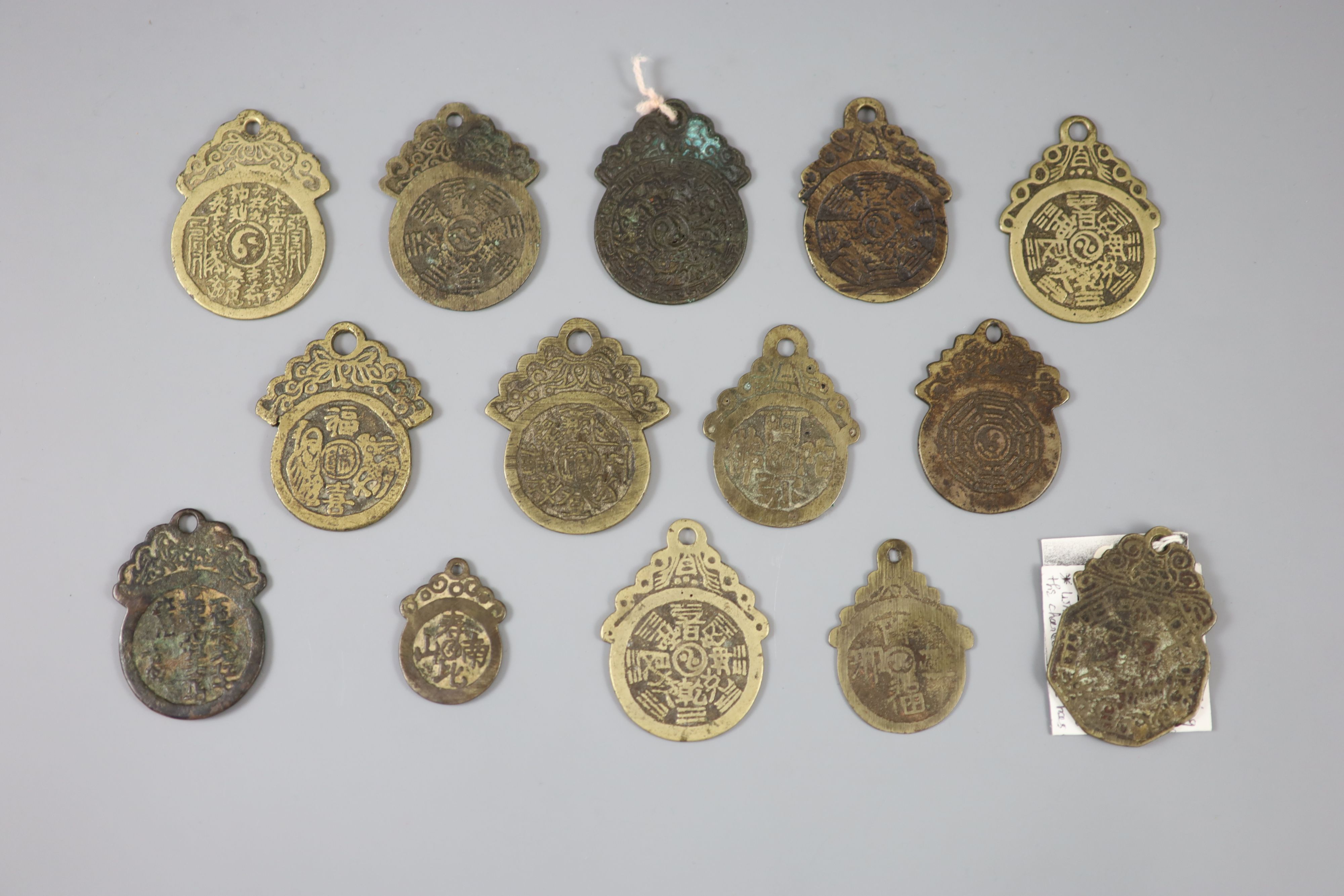 China, 14 bronze pendant charms or amulets, Qing dynasty,